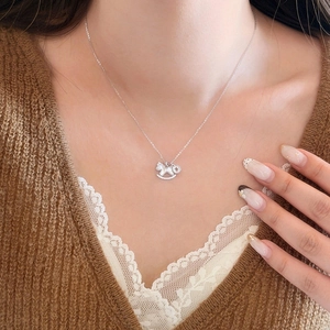 Elegant zircon and mother-of-pearl rocking horse necklace on a delicate O-chain