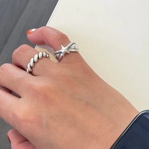 Minimalist 925 sterling silver star ring set with vintage twist band on female hand