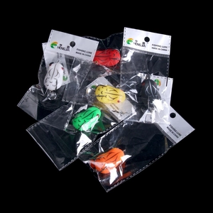 Set of six assorted color frog fishing lures in protective plastic packaging