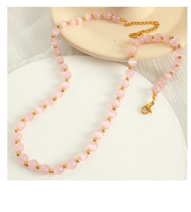 Detailed close-up of pink opal beaded necklace with gold stainless steel lobster clasp