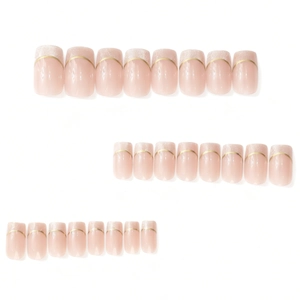 French press-on nails with nude pink base, gold crescent accent, and silver glitter tips