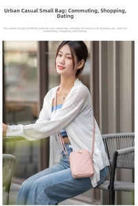 Outdoor shot of light pink quilted crossbody phone bag with adjustable leather strap