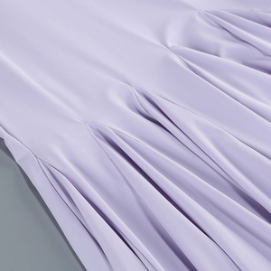 Macro view of lavender purple pleated fabric with fine texture on a bodycon dress