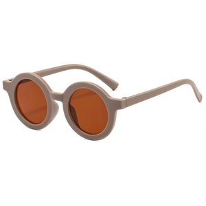 Detail view of round matte beige frame kids sunglasses with vintage orange lenses
