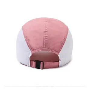 Detail of the pink and white mesh baseball cap with adjustable rear plastic buckle strap