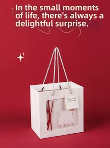 White gift bag with transparent window, silver handles and red ribbon for Valentine