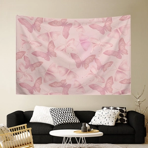 Pink butterfly tapestry wall hanging for bedroom decor displayed above a modern sofa