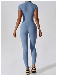 Rear view of body-sculpting fitness jumpsuit showing compression fabric and high-waist fit
