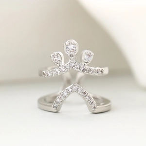 Macro shot of silver crown double-layer ring featuring sparkling white cubic zirconia stones