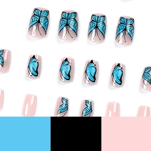 Blue glitter butterfly press on nails with soft nude base and sparkling sequins