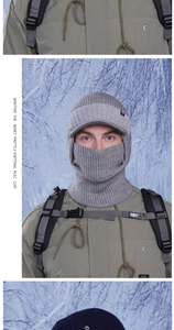 Detail of grey knitted balaclava mask with brim and fleece lining for outdoor winter gear
