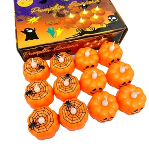 Set of 12 Halloween pumpkin LED candles with orange spider web and face patterns