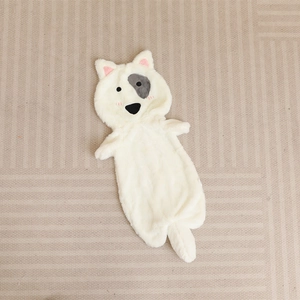 Detail of soft cream plush dog shell with grey eye circles and pink ear accents