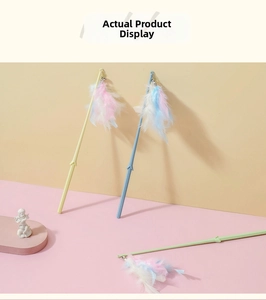Detailed view of macaron feather cat wands with colorful bells and suction cup wire