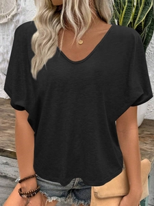 Detail of a casual black V-neck short sleeve T-shirt with soft wrinkled fabric texture