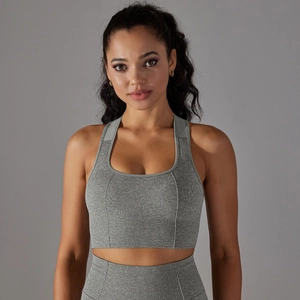 Close-up of grey seamless knit fabric and wide hem on a high-impact sports bra