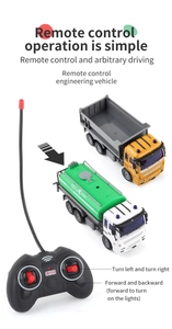 Detail of yellow dump truck and white oil tanker with wireless remote control system