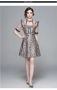 Detail of beaded pearls and lace collar on floral vintage high-waist dress