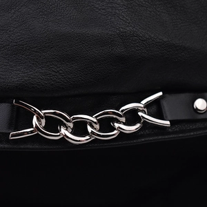 Close-up of black lychee grain leather with silver metal chain and rivet detail