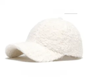 Detailed view of light yellow sherpa baseball cap with thick teddy fleece texture