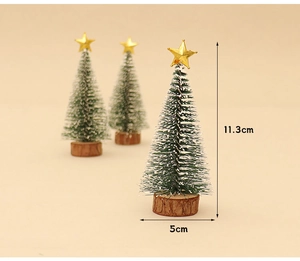 Detail view of mini snow-flocked Christmas tree with dimensions 11.3cm height and wood base