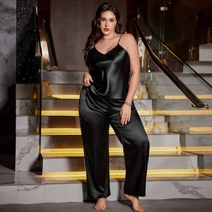 Elegant black silk satin pajama set with V-neck camisole and wide leg pants for loungewear