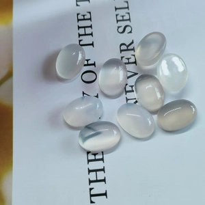 Macro shot of oval white chalcedony gemstones for DIY jewelry making and settings