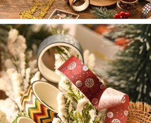 Close-up of festive Christmas washi tape with gold foil snowflakes and patterns
