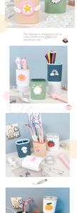 Detail of multi-compartment cartoon desk organizer with 3D stars and rainbow decorations
