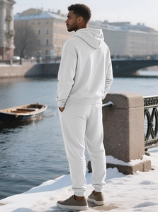 Close-up of men's white waffle knit tracksuit set with premium textured hoodie and pants