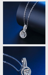 Macro detail of a 2ct round moissanite pendant necklace with silver chain and pavé setting