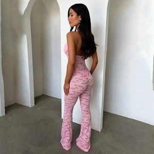 Pink lace hollow-out halter jumpsuit with backless design on female model