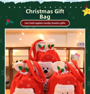 Detail of red plush Christmas gift bag featuring Santa and white bear ornaments