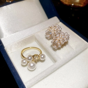 Detail of luxury pearl earring and ring set with zircon inlay in a premium jewelry box