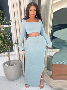 Light blue knit two-piece set featuring long sleeve crop top and side slit maxi skirt
