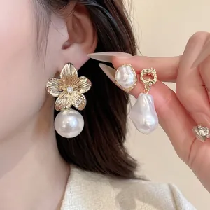 French vintage flower and baroque pearl earring set with golden metallic texture