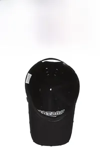 Detail view of cotton baseball cap interior showing Boston embroidery and washing label