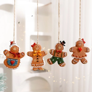 Set of four unique gingerbread man ornaments with festive details for Christmas trees