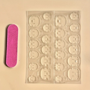 Short oval pink gradient fake nail kit with adhesive tabs and pink mini nail file
