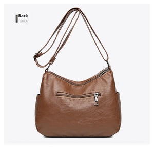 Rear view of brown PU leather crossbody bag featuring a functional back zipper pocket