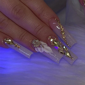 Luxurious long coffin press-on nails with 3D white flowers and sparkling rhinestones