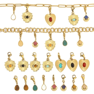Detailed selection of gold-plated stainless steel pendants with semi-precious stones and lobster clasps