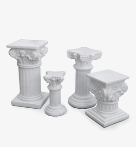 Detailed view of four assorted white Roman column statues for photography props