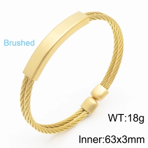 Gold stainless steel twisted wire cable cuff bracelet for men featuring brushed metal plate