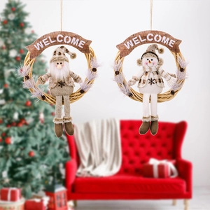 Close-up of Christmas rattan wreaths with snowman and Santa dolls in a festive setting