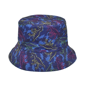 Close-up of deep blue bucket hat with colorful dinosaur silhouette patterns and canvas texture