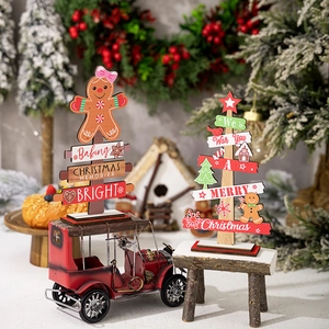 Wooden Christmas table decor featuring gingerbread man and tiered tree with festive ornaments