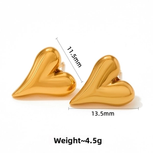 Detail view of heart-shaped gold studs showing 11.5mm height and 13.5mm width dimensions