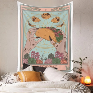 Tarot tapestry featuring THE TACO design hanging in a cozy bohemian bedroom decor setting