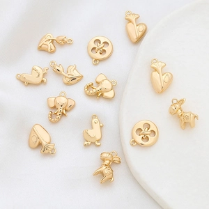 Polished gold elephant and heart shaped charms for DIY jewelry making and crafts